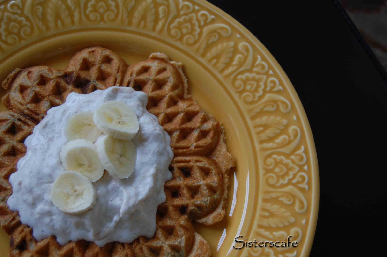 Peanut Butter-Chocolate Chip Waffles with Banana Cream on a yellow plate