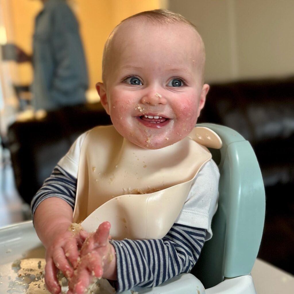 Baby boy eating cake