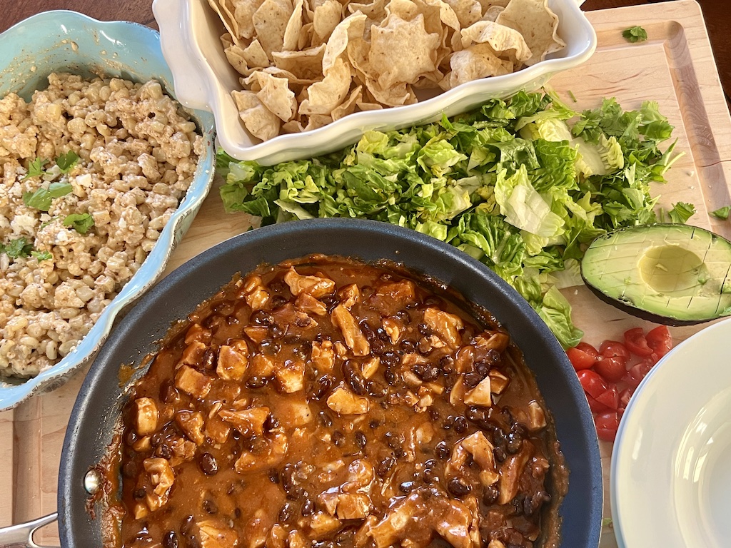 Elote Chicken Enchilada Bowl ingredients on a cutting board