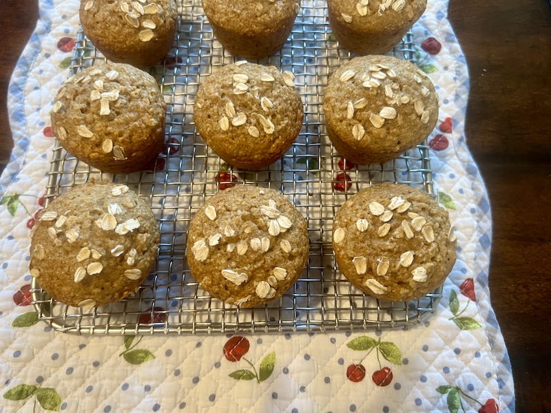 cooling rack full of applesauce oatmeal muffins
