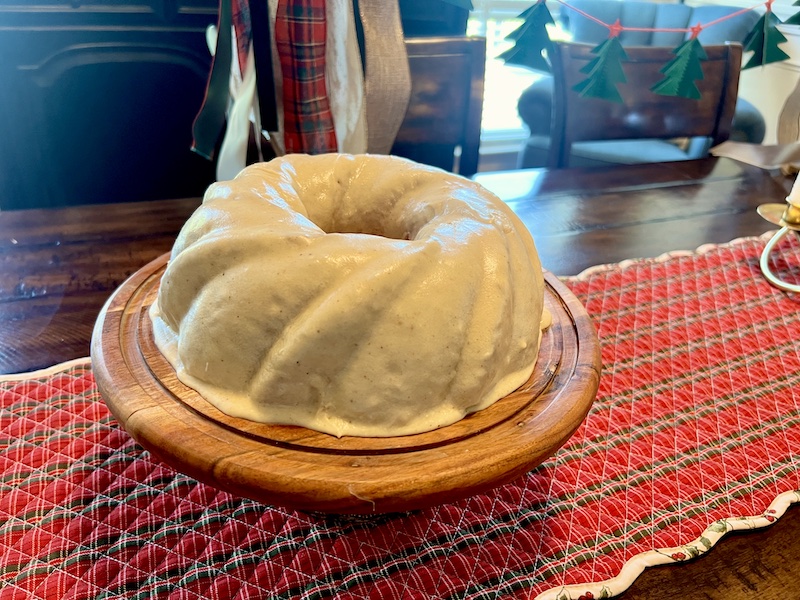 Eggnog Bundt Cake with Browned Butter Glaze on a cake stand