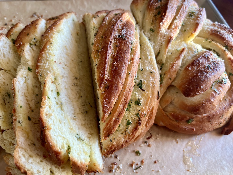 Freshly baked and sliced Garlic Herb Swirl Bread